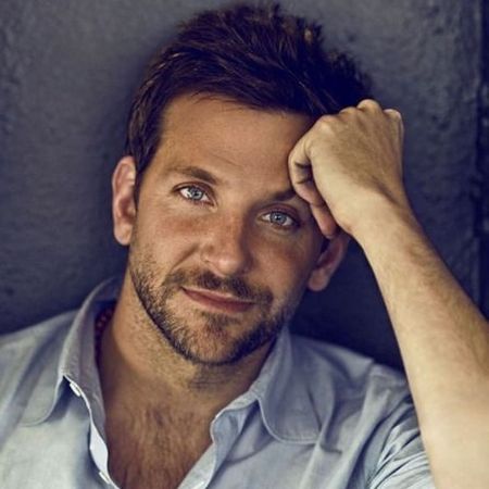 Bradley Cooper in a shirt posing for a picture